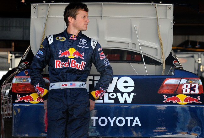 MARTINSVILLE, VA - OCTOBER 23:  Kasey Kahne, driver of the #83 Red Bull Toyota, stands in the garage prior to practice for the NASCAR Sprint Cup Series TUMS Fast Relief 500 at Martinsville Speedway on October 23, 2010 in Martinsville, Virginia.  (Photo by Jared C. Tilton/Getty Images for NASCAR)