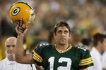 GREEN BAY, WI - SEPTEMBER 13: Aaron Rodgers #12 of the Green Bay Packers celebrates throwing the winning touchdown pass against the Chicago Bears on September 13, 2009 at Lambeau Field in Green Bay, Wisconsin. The Packers defeated the Bears 21-15.  (Photo by Jonathan Daniel/Getty Images)