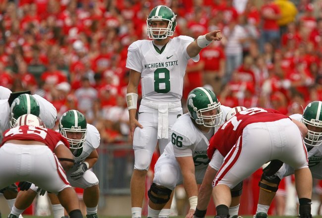MADISON, WI - SEPTEMBER 26: Kirk Cousins #8 of the Michigan State Spartans motions on the line against the Wisconsin Badgers on September 26, 2009 at Camp Randall Stadium in Madison, Wisconsin. (Photo by Jonathan Daniel/Getty Images)