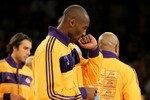LOS ANGELES, CA - OCTOBER 26:  Kobe Bryant #24 of the Los Angeles Lakers kisses his 2009-2010 Championship Ring after the Lakers were given the rings during a ceremony prior to their opening night game against the Houston Rockets at Staples Center on October 26, 2010 in Los Angeles, California. NOTE TO USER: User expressly acknowledges and agrees that, by downloading and or using this photograph, User is consenting to the terms and conditions of the Getty Images License Agreement.  (Photo by Jeff Gross/Getty Images)