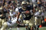 EAST RUTHERFORD, NJ - OCTOBER 23: Alexander Teich #39 of the Navy Midshipmen rushes past the tackle of Darrin Walls #2 of the Notre Dame Fighting Irish at New Meadowlands Stadium on October 23, 2010 in East Rutherford, New Jersey.  (Photo by Nick Laham/Getty Images)
