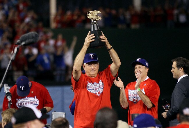 ARLINGTON, TX - OCTOBER 22:  Team president Nolan Ryan of the Texas Rangers holds the Warren C. Giles Trophy after defeating the New York Yankees in Game Six of the ALCS to advance to the World Series during the 2010 MLB Playoffs at Rangers Ballpark in Arlington on October 22, 2010 in Arlington, Texas.  (Photo by Elsa/Getty Images)