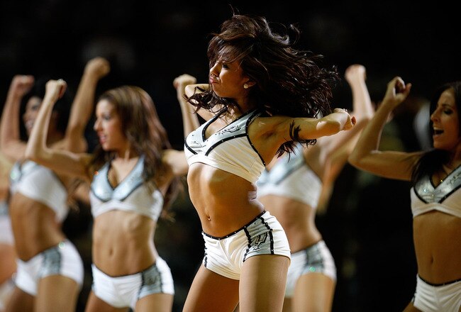 SAN ANTONIO - OCTOBER 09:  Cheerleaders perform during the game between the Miami Heat and the San Antonio Spurs at the AT&T Center on October 9, 2010 in San Antonio, Texas.  NOTE TO USER: User expressly acknowledges and agrees that, by downloading and/or using this Photograph, User is consenting to the terms and conditions of the Getty Images License Agreement.  (Photo by Chris Graythen/Getty Images)