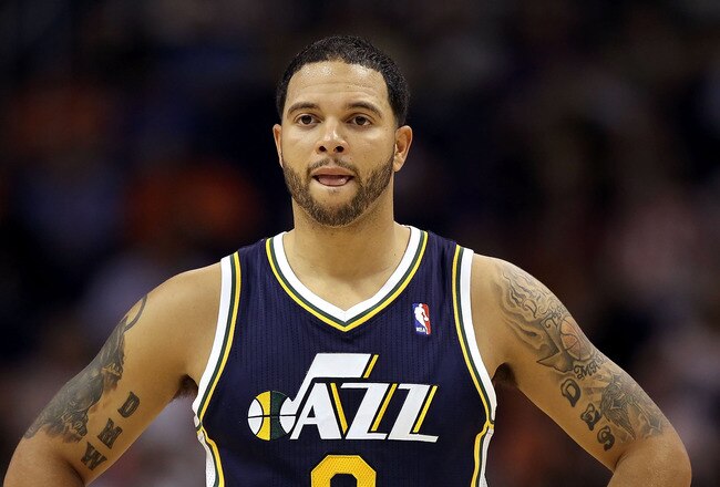 PHOENIX - OCTOBER 12:  Deron Williams #8 of the Utah Jazz in action during the preseason NBA game against the Phoenix Suns at US Airways Center on October 12, 2010 in Phoenix, Arizona. NOTE TO USER: User expressly acknowledges and agrees that, by downloading and or using this photograph, User is consenting to the terms and conditions of the Getty Images License Agreement.  (Photo by Christian Petersen/Getty Images)