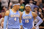 SALT LAKE CITY - APRIL 30:  Kenyon Martin #4 of the Denver Nuggets speaks to teammate Carmelo Anthony #15 during their loss to the Utah Jazz in Game Six of the Western Conference Quarterfinals of the 2010 NBA Playoffs at EnergySolutions Arena on April 30, 2010 in Salt Lake City, Utah. NOTE TO USER: User expressly acknowledges and agrees that, by downloading and or using this photograph, User is consenting to the terms and conditions of the Getty Images License Agreement.  (Photo by Ezra Shaw/Getty Images)