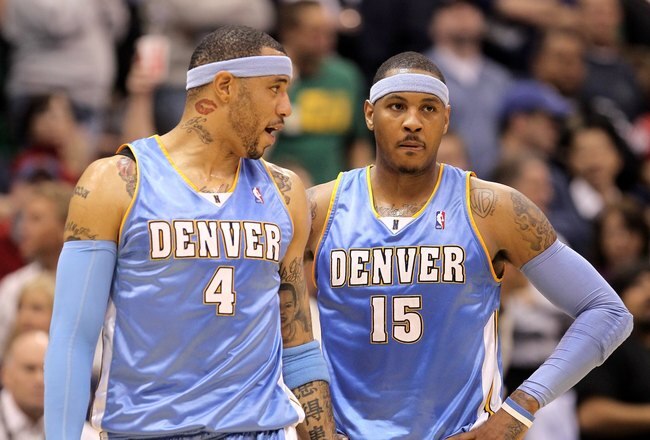SALT LAKE CITY - APRIL 30:  Kenyon Martin #4 of the Denver Nuggets speaks to teammate Carmelo Anthony #15 during their loss to the Utah Jazz in Game Six of the Western Conference Quarterfinals of the 2010 NBA Playoffs at EnergySolutions Arena on April 30, 2010 in Salt Lake City, Utah. NOTE TO USER: User expressly acknowledges and agrees that, by downloading and or using this photograph, User is consenting to the terms and conditions of the Getty Images License Agreement.  (Photo by Ezra Shaw/Getty Images)
