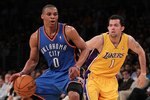 LOS ANGELES, CA - APRIL 27:  Russell Westbrook #0 of the Oklahoma City Thunder drives on Jordan Farmar #1 of the Los Angeles Lakers during Game Five of the Western Conference Quarterfinals of the 2010 NBA Playoffs at Staples Center on April 27, 2010 in Los Angeles, California.  (Photo by Stephen Dunn/Getty Images)