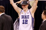 INDIANAPOLIS - APRIL 05:  Kyle Singler #12 of the Duke Blue Devils celebrates after Duke won 61-59 against the Butler Bulldogs during the 2010 NCAA Division I Men's Basketball National Championship game at Lucas Oil Stadium on April 5, 2010 in Indianapolis, Indiana.  (Photo by Kevin C. Cox/Getty Images)
