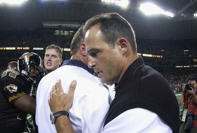 ST. LOUIS, MO - AUGUST 31:  Head coach Gary Pinkel of the Missouri Tigers is congratulated on his teams win over the Illinois Fighting Illini during the game at the Edward Jones Dome on August 31, 2002 in St. Louis, Missouri.  Missouri won 33-20.   (Photo by Elsa/Getty Images)
