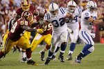 LANDOVER, MD - OCTOBER 17:  Running back Mike Hart #32 of the Indianapolis Colts is tackled by London Fletcher #59 of the Washington Redskins at FedEx Field on October 17, 2010 in Landover, Maryland. The Colts won the game 27-24.  (Photo by Win McNamee/Getty Images)