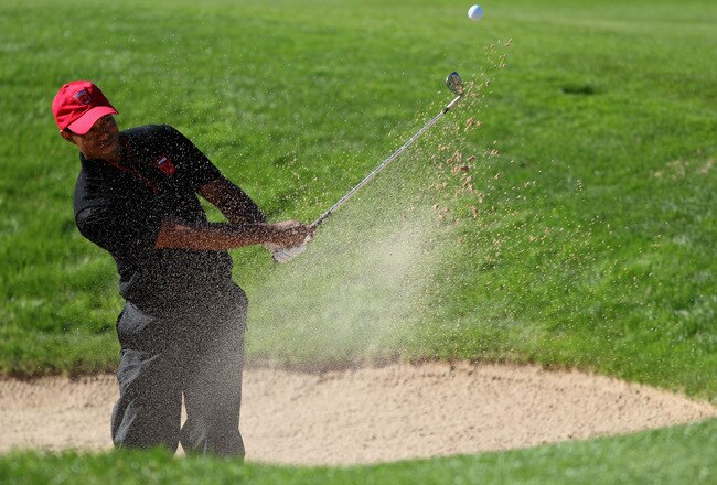 NEWPORT, WALES - OCTOBER 04:  Tiger Woods of the USA plays a bunker shot on the 14th hole in the singles matches during the 2010 Ryder Cup at the Celtic Manor Resort on October 4, 2010 in Newport, Wales.  (Photo by Jamie Squire/Getty Images)