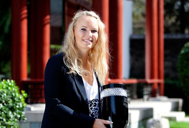 BEIJING - OCTOBER 12: Caroline Wozniacki of Denmark poses with her WTA Tour World Number 1 trophy in the garden of the Shangri-La Hotel on October 12, 2010 in Beijing, China.   (Photo by Lintao Zhang/Getty Images)