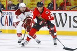 OTTAWA, ON - OCTOBER 26:  Alex Kovalev #27 of the Ottawa Senators carries the puck hard to the net while being pursued by Ray Whitney #13 of the Phoenix Coyotes during a game at Scotiabank Place on October 26, 2010 in Ottawa, Ontario, Canada.  The Ottawa Senators defeated the Phoenix Coyotes 5-2.  (Photo by Phillip MacCallum/Getty Images)