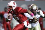 RALEIGH, NC - OCTOBER 28:  Everett Dawkins #93 of the Florida State Seminoles chases Russell Wilson #16 of the North Carolina State Wolfpack during their game at Carter-Finley Stadium on October 28, 2010 in Raleigh, North Carolina.  (Photo by Streeter Lecka/Getty Images)