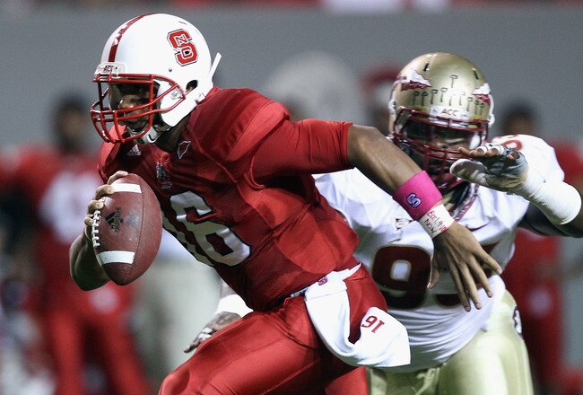 RALEIGH, NC - OCTOBER 28:  Everett Dawkins #93 of the Florida State Seminoles chases Russell Wilson #16 of the North Carolina State Wolfpack during their game at Carter-Finley Stadium on October 28, 2010 in Raleigh, North Carolina.  (Photo by Streeter Lecka/Getty Images)
