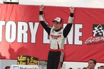 MADISON, IL - OCTOBER 23: Brad Keselowski, driver of the #22 Discount Tire Dodge celebrates after winning the NASCAR 5-hour Energy 250 at Gateway International Raceway on October 23, 2010 in Madison, Illinois.  (Photo by John Sommers II/Getty Images)