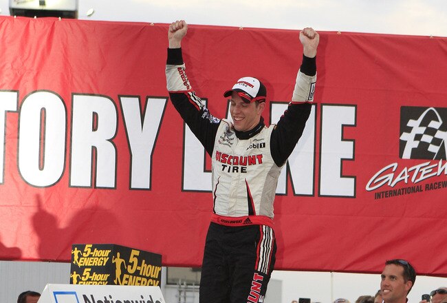 MADISON, IL - OCTOBER 23: Brad Keselowski, driver of the #22 Discount Tire Dodge celebrates after winning the NASCAR 5-hour Energy 250 at Gateway International Raceway on October 23, 2010 in Madison, Illinois.  (Photo by John Sommers II/Getty Images)