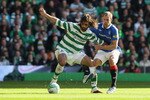 GLASGOW, SCOTLAND - OCTOBER 24:  Georgios Samaras of Celtic holds off a challenge from Steven Whittaker of Rangers during the Clydesdale Bank Premier League match between Celtic and Rangers at Celtic Park on October 24, 2010 in Glasgow, Scotland.  (Photo by Clive Brunskill/Getty Images)