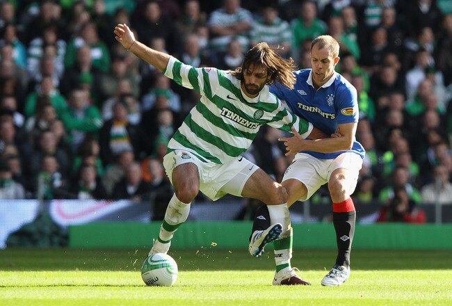 GLASGOW, SCOTLAND - OCTOBER 24:  Georgios Samaras of Celtic holds off a challenge from Steven Whittaker of Rangers during the Clydesdale Bank Premier League match between Celtic and Rangers at Celtic Park on October 24, 2010 in Glasgow, Scotland.  (Photo by Clive Brunskill/Getty Images)