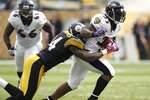 PITTSBURGH - OCTOBER 03:  Willis McGahee #23 of the Baltimore Ravens tries to escape the tackle of Lawrence Timmons #94 of the Pittsburgh Steelers on October 3, 2010 at Heinz Field in Pittsburgh, Pennsylvania. Baltimore won the game 17-14.  (Photo by Gregory Shamus/Getty Images)