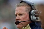 SOUTH BEND, IN - SEPTEMBER 04: Head coach Brian Kelly of the Notre Dame Fighting Irish encourages his team against the Purdue Boilermakers at Notre Dame Stadium on September 4, 2010 in South Bend, Indiana. (Photo by Jonathan Daniel/Getty Images)