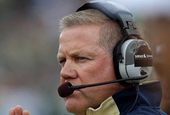 SOUTH BEND, IN - SEPTEMBER 04: Head coach Brian Kelly of the Notre Dame Fighting Irish encourages his team against the Purdue Boilermakers at Notre Dame Stadium on September 4, 2010 in South Bend, Indiana. (Photo by Jonathan Daniel/Getty Images)