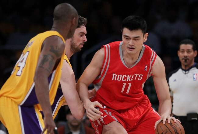 LOS ANGELES, CA - OCTOBER 26:  Pau Gasol #16 of the Los Angeles Lakers defends as Yao Ming #11 of the Houston Rockets controls the ball during their NBA game at Staples Center on October 26, 2010 in Los Angeles, California. NOTE TO USER: User expressly acknowledges and agrees that, by downloading and or using this photograph, User is consenting to the terms and conditions of the Getty Images License Agreement.  (Photo by Jeff Gross/Getty Images)