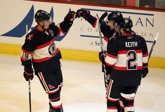 CHICAGO - OCTOBER 29: Jonathan Toews #19 of the Chicago Blackhawks (L) and Duncan Keith #2 congratulate Patrick Sharp #10 after Sharp scored a goal in the 3rd period against the Edmonton Oilers at the United Center on October 29, 2010 in Chicago, Illinois. The Oilers defeated the Blackhawks 7-4. (Photo by Jonathan Daniel/Getty Images)