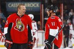 OTTAWA, ON - OCTOBER 26:  In his 1000th NHL regular season game Sergei Gonchar #55 of the Ottawa Senators discusses strategy with teammate Daniel Alfredsson #11 during a game against the Phoenix Coyotes at Scotiabank Place on October 26, 2010 in Ottawa, Ontario, Canada.  (Photo by Phillip MacCallum/Getty Images)