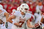 LINCOLN, NE - OCTOBER 16: Quarterback Garrett Gilbert #7 of the Texas Longhorns prepares to hand the ball off during their game at Memorial Stadium on October 16, 2010 in Lincoln, Nebraska. Texas Defeated Nebraska 20-13. (Photo by Eric Francis/Getty Images)