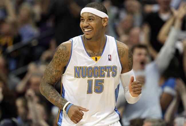 DENVER, CO - APRIL 17 : Carmelo Anthony #15 of the Denver Nuggets celebrates after sinking a shot against the Utah Jazz during the second half of Game One of the Western Conference Quarterfinals of the 2010 NBA Playoffs at the Pepsi Center on April 17, 2010 in Denver, Colorado. The Nuggets won the game 126-113 to take a 1-0 lead in the series. NOTE TO USER: User expressly acknowledges and agrees that, by downloading and/or using this Photograph, user is consenting to the terms and conditions of the Getty Images License Agreement. (Photo by Marc Piscotty/Getty Images)