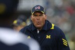 SOUTH BEND, IN - SEPTEMBER 11: Head coach Rich Rodriguez of the Michigan Wolverines yells at an assistant coach during a game against the Notre Dame Fighting Irish at Notre Dame Stadium on September 11, 2010 in South Bend, Indiana. Michigan defeated Notre Dame 28-24. (Photo by Jonathan Daniel/Getty Images)