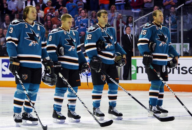 SAN JOSE, CA - SEPTEMBER 25: Douglas Murray #3, Joe Pavelski #8, Patrick Marleau #12, and Dany Heatley #15 of the San Jose Sharks stop for the national anthem before a preseason split-squad game against the Phoenix Coyotes at HP Pavilion on September 25, 2010 in San Jose, California.  The Sharks won 3-1.  (Photo by Brian Bahr/Getty Images)