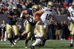 EAST RUTHERFORD, NJ - OCTOBER 23:  Dayne Crist #10 of the Notre Dame Fighting Irish rushes against the Navy Midshipmen at New Meadowlands Stadium on October 23, 2010 in East Rutherford, New Jersey.  (Photo by Nick Laham/Getty Images)