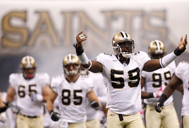 NEW ORLEANS - OCTOBER 24:  Anthony Waters #59 of the New Orleans Saints runs on the field during player introductions before playing against the Cleveland Browns at the Louisiana Superdome on October 24, 2010 in New Orleans, Louisiana.  The Browns defeated the Saints 30-17.  (Photo by Chris Graythen/Getty Images)