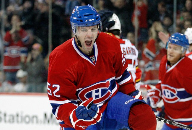 MONTREAL- OCTOBER 30:  Mathieu Darche #52 of the Montreal Canadiens celebrates his second period goal against the Florida Panthers during the NHL game at the Bell Centre on October 30, 2010 in Montreal, Quebec, Canada.  (Photo by Richard Wolowicz/Getty Images)
