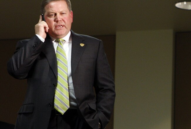 SOUTH BEND, IN - DECEMBER 11: Brian Kelly talks on his phone shortly after being named new football head coach at Notre Dame University on December 11, 2009 in South Bend, Indiana.  Kelly most recently led the University of Cincinnati to two consecutive Bowl Championship Series appearances including a perfect 12-0 record this past season. (Photo by Frank Polich/Getty Images)