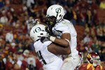 LOS ANGELES, CA - OCTOBER 30:  LaMichael James #21 of the Oregon Ducks celebrates his touchdown with Darrion Weems #74 on way to a 53-32 victory over the USC Trojans during the fourth quarter at Los Angeles Memorial Coliseum on October 30, 2010 in Los Angeles, California.  (Photo by Harry How/Getty Images)