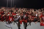 RALEIGH, NC - OCTOBER 28:  Darrell Davis #15 of the North Carolina State Wolfpack celebrates with fans after deafeating the Florida State Seminoles 28-24 at Carter-Finley Stadium on October 28, 2010 in Raleigh, North Carolina.  (Photo by Streeter Lecka/Getty Images)