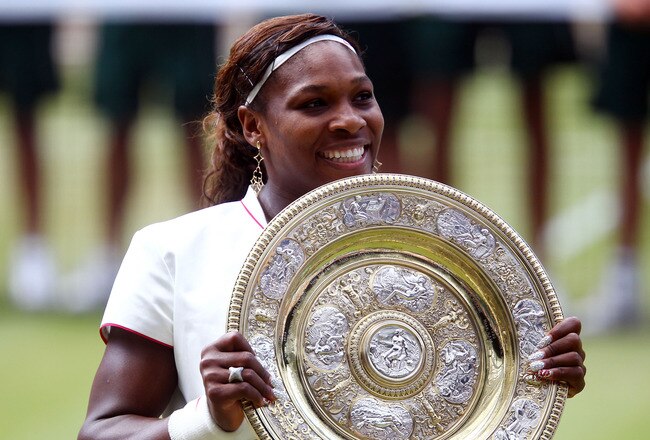 LONDON, ENGLAND - JULY 03:  Serena Williams of USA lifts the Championship trophy after winning her Ladies Singles Final Match against Vera Zvonareva of Russia on Day Twelve of the Wimbledon Lawn Tennis Championships at the All England Lawn Tennis and Croquet Club on July 3, 2010 in London, England.  (Photo by Julian Finney/Getty Images)