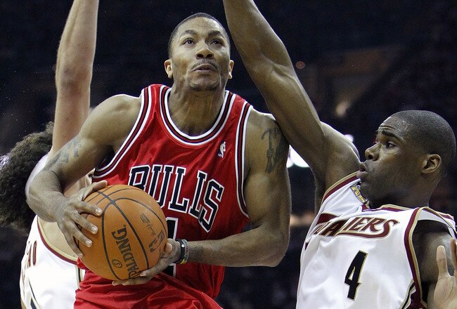 CLEVELAND - APRIL 27:  Derrick Rose #1 of the Chicago Bulls goes up for a shot against Antawn Jamison #4 and Anderson Varejao #17 of the Cleveland Cavaliers in Game Five of the Eastern Conference Quarterfinals during the 2010 NBA Playoffs at Quicken Loans Arena on April 27, 2010 in Cleveland, Ohio.  NOTE TO USER: User expressly acknowledges and agrees that, by downloading and or using this photograph, User is consenting to the terms and conditions of the Getty Images License Agreement.  (Photo by Gregory Shamus/Getty Images)