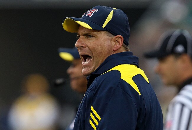 SOUTH BEND, IN - SEPTEMBER 11: Head coach Rich Rodriguez of the Michigan Wolverines yells at an assistant coach during a game against the Notre Dame Fighting Irish at Notre Dame Stadium on September 11, 2010 in South Bend, Indiana. Michigan defeated Notre Dame 28-24. (Photo by Jonathan Daniel/Getty Images)