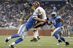 DETROIT - OCTOBER 31: Kyle Vanden Bosch #93 of the Detroit Lions hits Donovan McNabb #5 of the Washington Redskins during the first quarter of the game at Ford Field on October 31, 2010 in Detroit, Michigan. (Photo by Leon Halip/Getty Images)