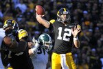 IOWA CITY, IA - OCTOBER 30: Quarterback Ricky Stanzi #12 of the University of Iowa Hawkeyes throw under pressure from defensive end Tyler Hoover #91 of the Michigan State Spartans during the first half of play at Kinnick Stadium on October 30, 2010 in Iowa City, Iowa. Iowa won 37-6 over Michigan State. (Photo by David Purdy/Getty Images)