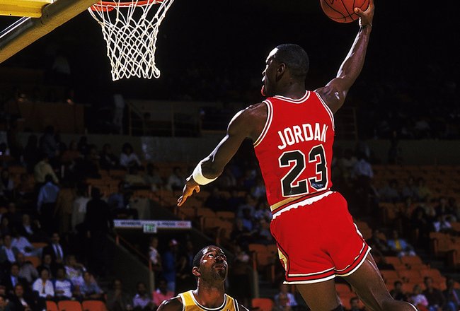 Michael Jordan #23 of the Chicago Bulls dunks the ball during a game against the Los Angeles Lakers.