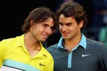 MADRID, SPAIN - MAY 17:  Roger Federer of Switzerland (R) and Rafael Nadal of Spain share a moment during the prize giving ceremony after the mens final during the Madrid Open tennis tournament at the Caja Magica on May 17, 2009 in Madrid, Spain.  (Photo by Clive Brunskill/Getty Images)