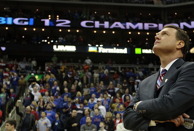 KANSAS CITY, MO - MARCH 13:  Head coach Bill Self of the Kansas Jayhawks watches highlights on the videoboard after the Jayhawks defeated the Kansas State Wildcats to win the 2010 Phillips 66 Big 12 Men's Basketball Championship on March 13, 2010 at the Sprint Center in Kansas City, Missouri.  (Photo by Jamie Squire/Getty Images)