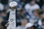 OAKLAND, CA - JANUARY 19:  A Raiders fan holds up a mock Vince Lombardi Trophy prior to the AFC Championship game between the Tennessee Titans and the Oakland Raiders at Network Associates Coliseum on January 19, 2003 in Oakland, California.  The Raiders defeated the Titans 41-24, sending them on to the NFL title game for the first time since 1984.  (Photo by Stephen Dunn/Getty Images)