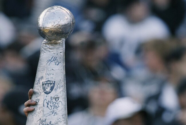 OAKLAND, CA - JANUARY 19:  A Raiders fan holds up a mock Vince Lombardi Trophy prior to the AFC Championship game between the Tennessee Titans and the Oakland Raiders at Network Associates Coliseum on January 19, 2003 in Oakland, California.  The Raiders defeated the Titans 41-24, sending them on to the NFL title game for the first time since 1984.  (Photo by Stephen Dunn/Getty Images)