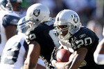 OAKLAND, CA - OCTOBER 31:  Darren McFadden #20 of the Oakland Raiders runs with the ball against the Seattle Seahawks at Oakland-Alameda County Coliseum on October 31, 2010 in Oakland, California.  (Photo by Ezra Shaw/Getty Images)